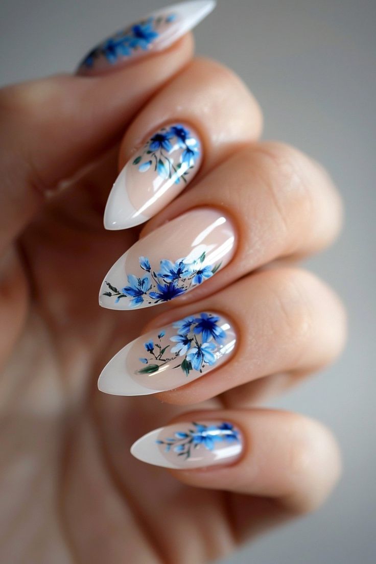 Elegant Blue Blossom Floral Nail Design: A Subtle Yet Striking Statement on Neutral Background.