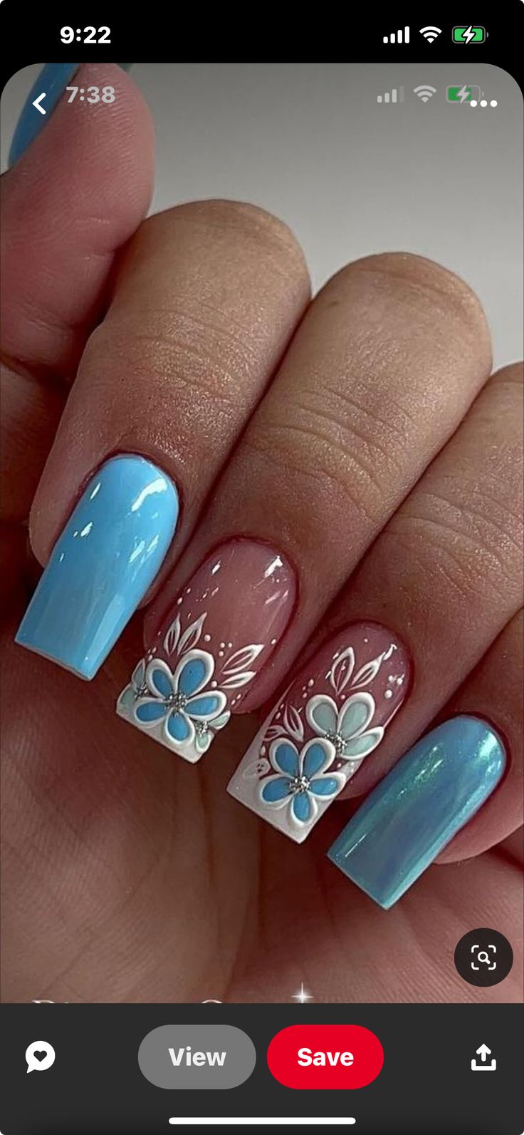 Chic Floral Nail Design in Soft Blue and Rosy Pink with Elegant Detailing