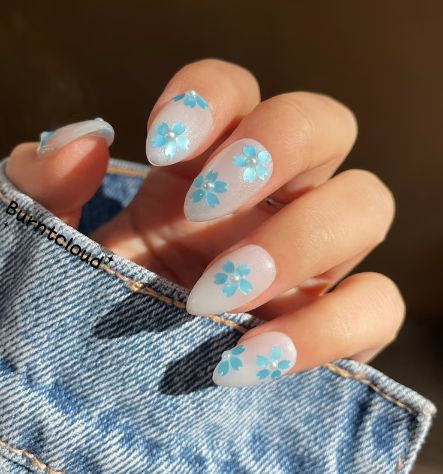 Elegant Floral Light Blue Nail Design for a Refreshing Spring/Summer Look.