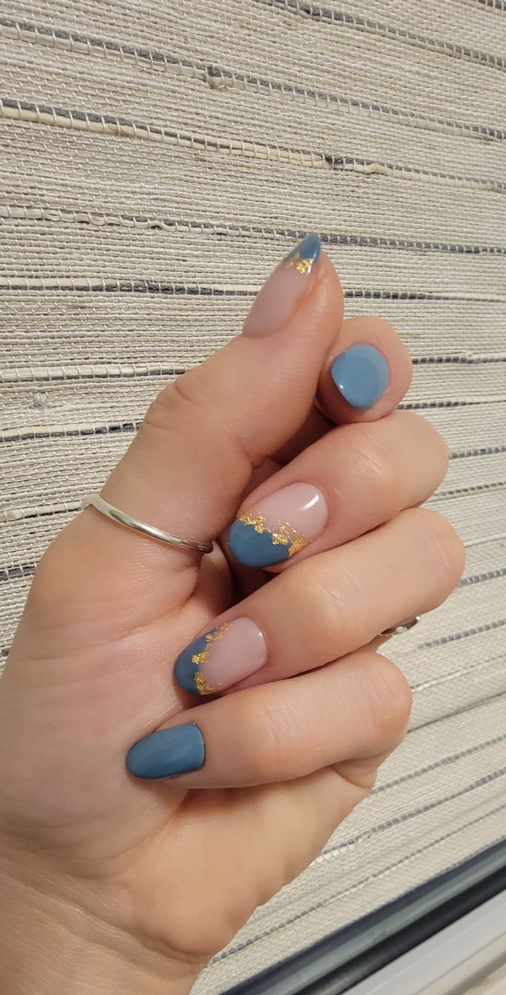 Elegant Matte Blue and Nude Nail Design with Gold Accents