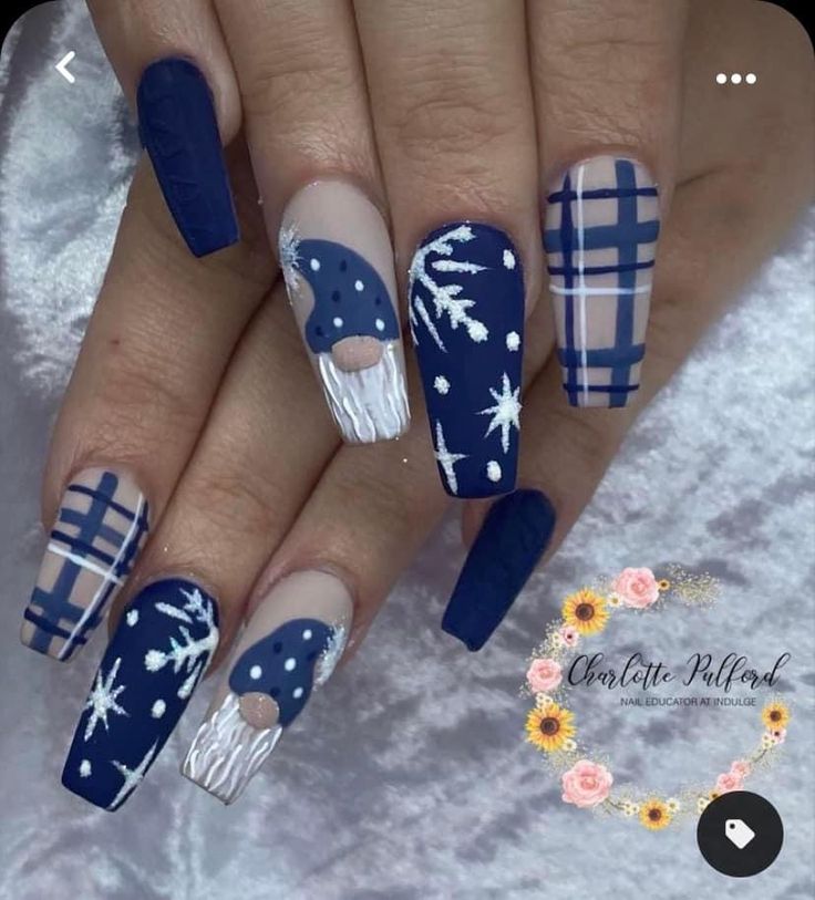 Elegant Winter-Themed Nail Art Design with Deep Navy and Light Blues