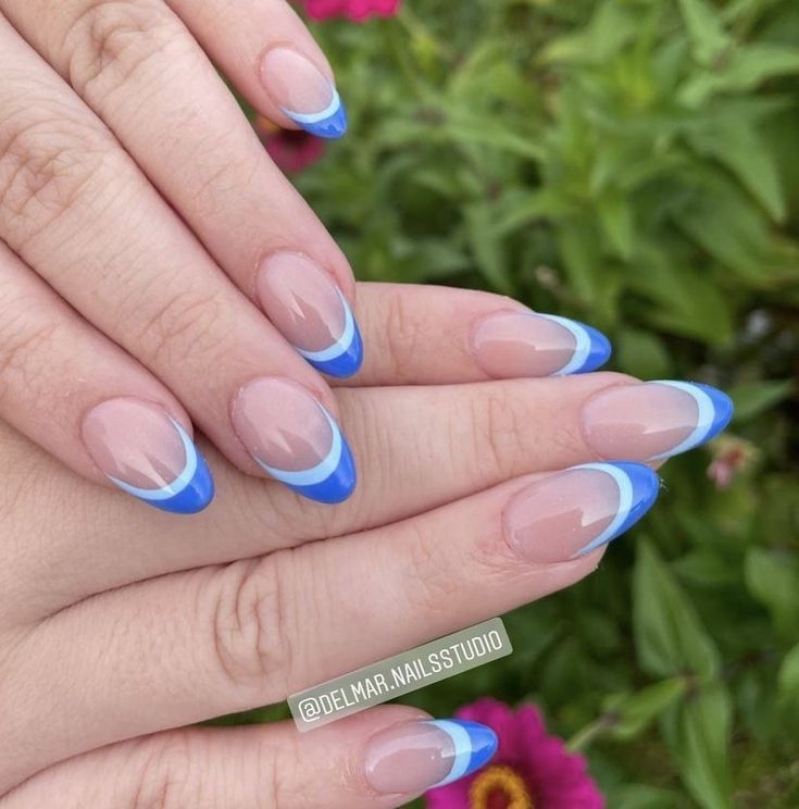 Elegant Gradient Blue French Manicure with Curved Tips and Delicate White Line.