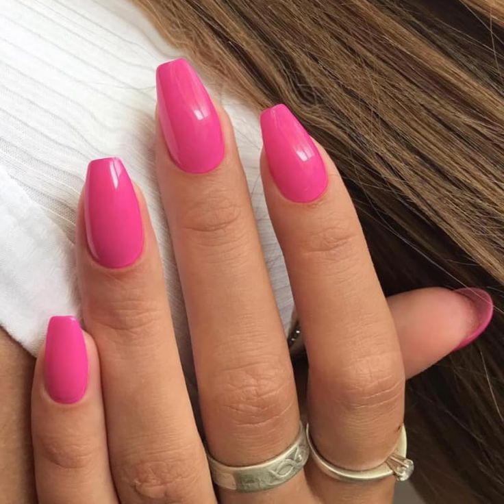 Bold Glossy Pink Nail Design: A Playful Statement for Any Occasion.