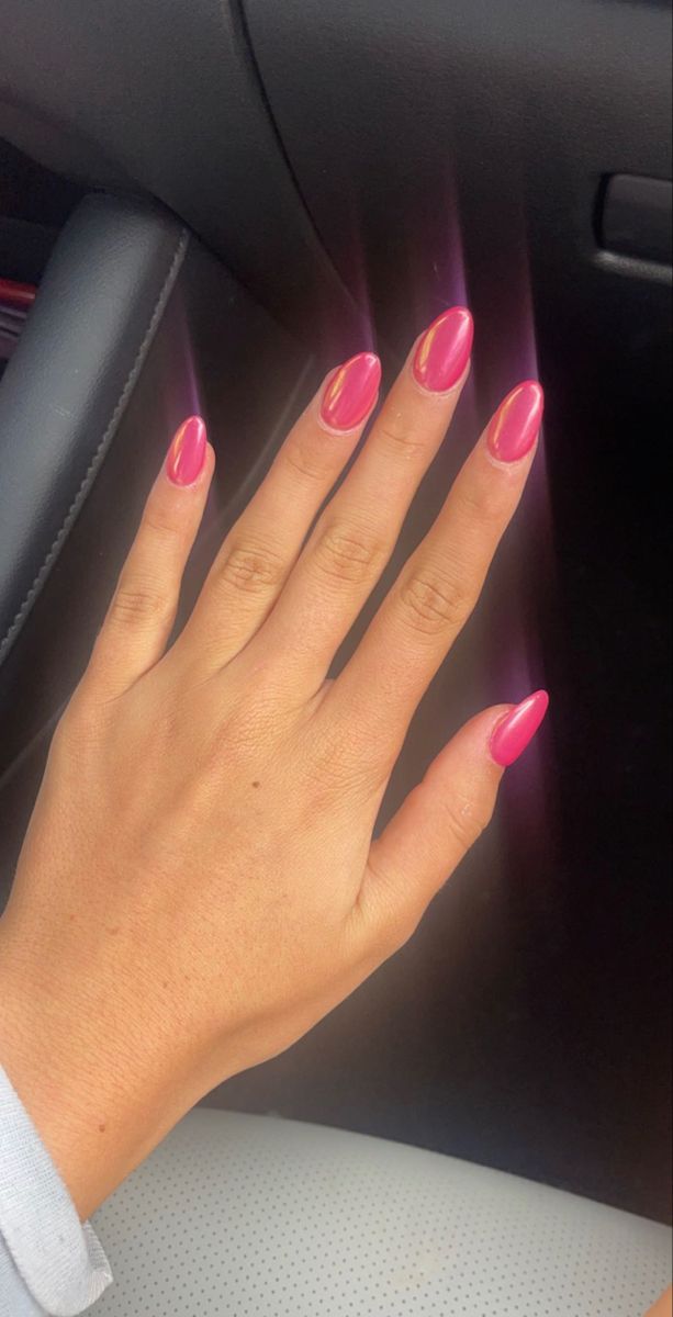 Elegant Almond-Shaped Glossy Pink Nails: Perfect Blend of Playfulness and Sophistication.