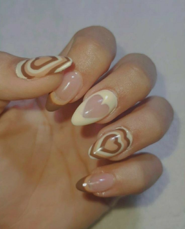 Chic Colorful Nail Design with Swirls and Hearts in Pink, Beige, and Brown Tones