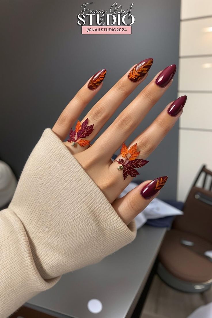 Autumn-Inspired Nail Design with Leaf Motifs and Coordinating Rings