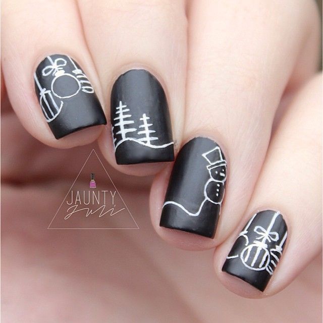 Matte Black Festive Nail Design with White Holiday-Themed Line Art.