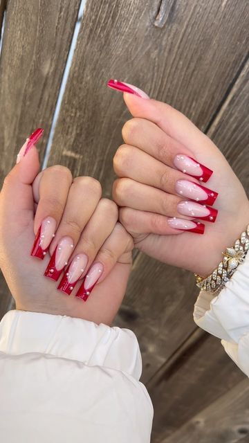 Chic French Manicure: Elegant Contrast of Soft Pink and Bold Red with Glossy Finish.