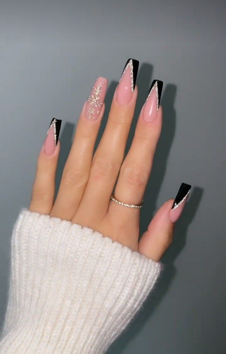 Elegant Chic Nail Design: Soft Pink and Bold Black with Sparkling French Tips and Intricate Accents.