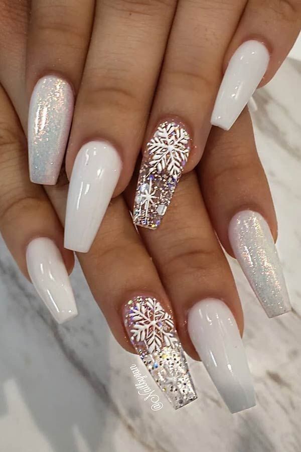 Chic Long Glossy White Nail Design with Glamorous Accents and Intricate Patterns