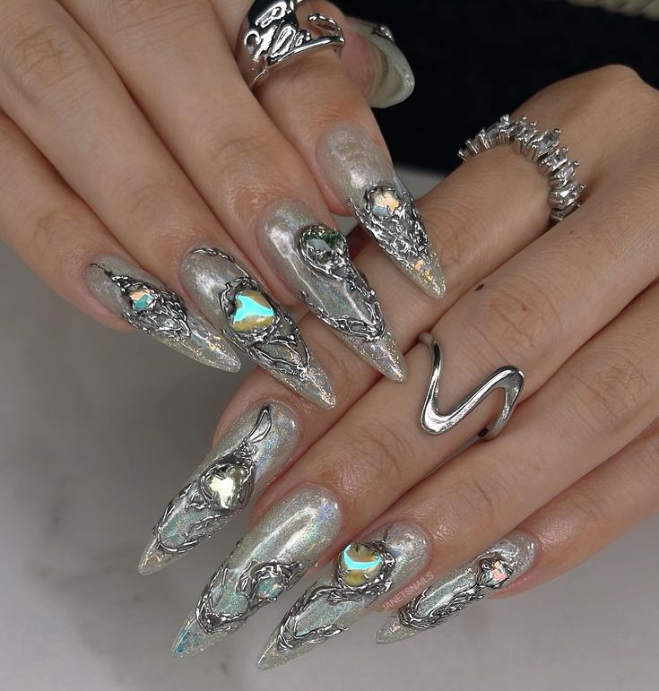 Elegant Elongated Nails with Shimmering Silver Finish and Iridescent Accents