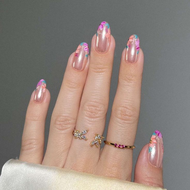 Chic Floral Nail Art with Nude Base and Whimsical Hand-Painted Accents