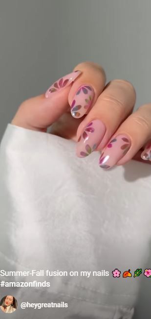 Chic Floral Nail Design: Harmonious Blend of Soft Pink, Leaves, and Seasonal Colors.