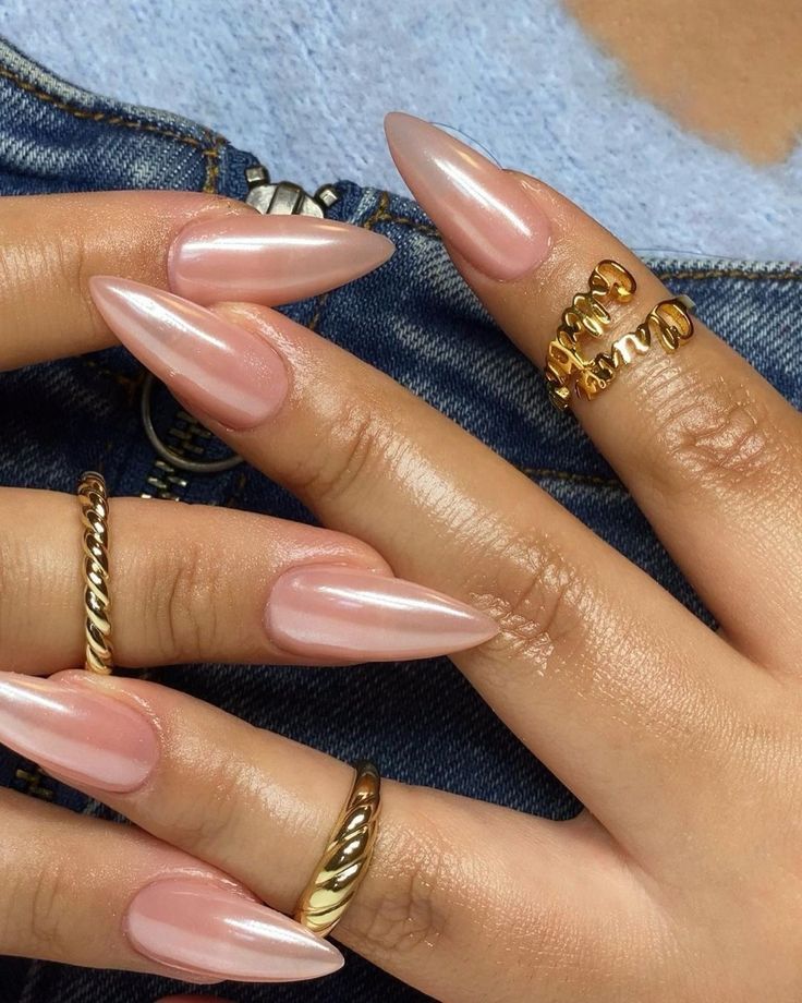 Chic Almond-Shaped Nails with Glossy Nude Finish and Luxurious Gold Accents.