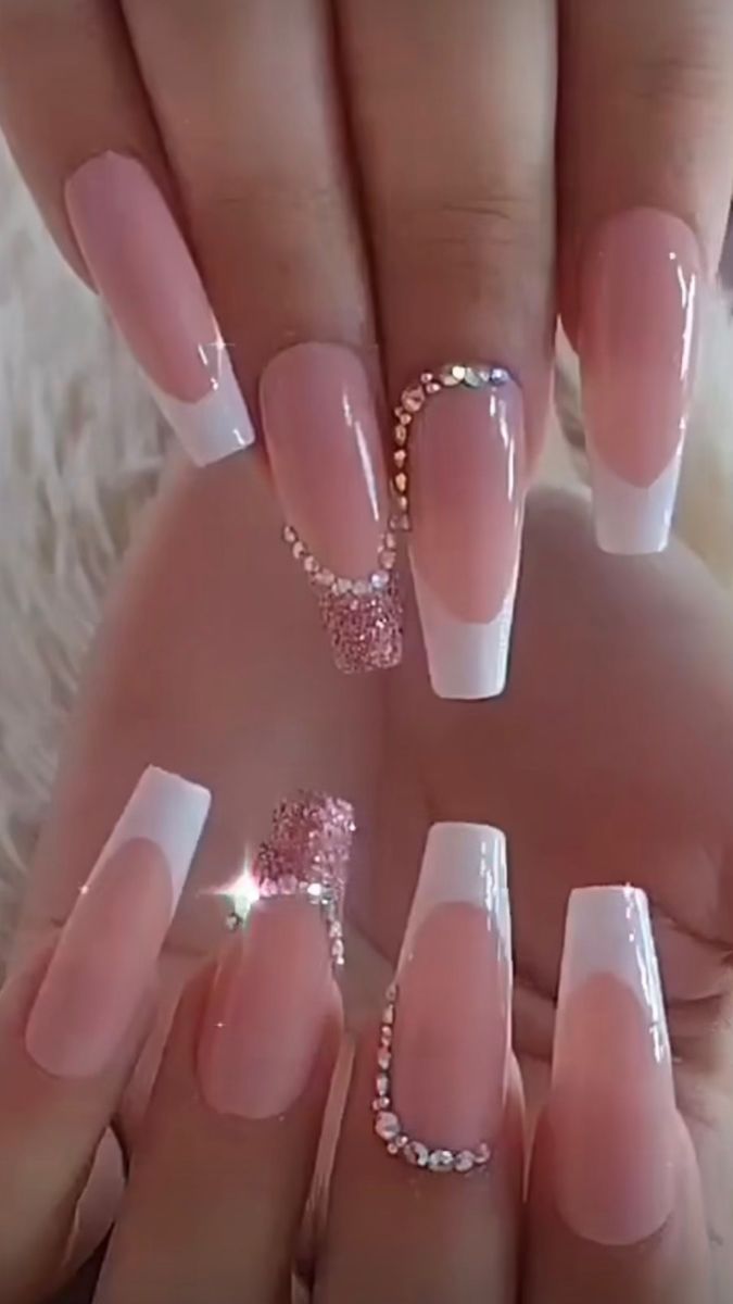 Sophisticated Nail Design: Elegant Elongated Pink and White Tips with Sparkling Accents for a Glamorous Look.