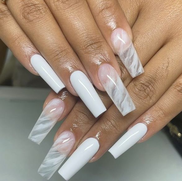 Sophisticated Long Nail Design with Glossy White and Subtle Marble Effect.