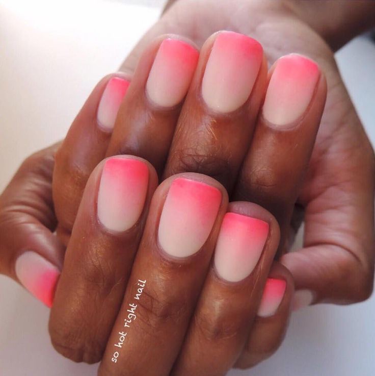 Elegant Ombre Nail Design: Soft Nude to Vibrant Pink Gradient.