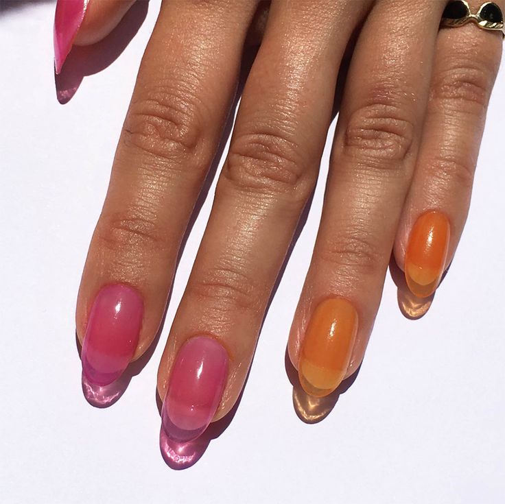 Playful Vibrant Gradient Nail Design in Warm Pink and Orange Ombre.