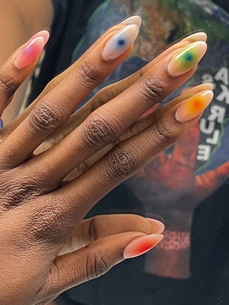 Playful Pastel and Vibrant Accent Nail Design with Unique Abstract Artistry.