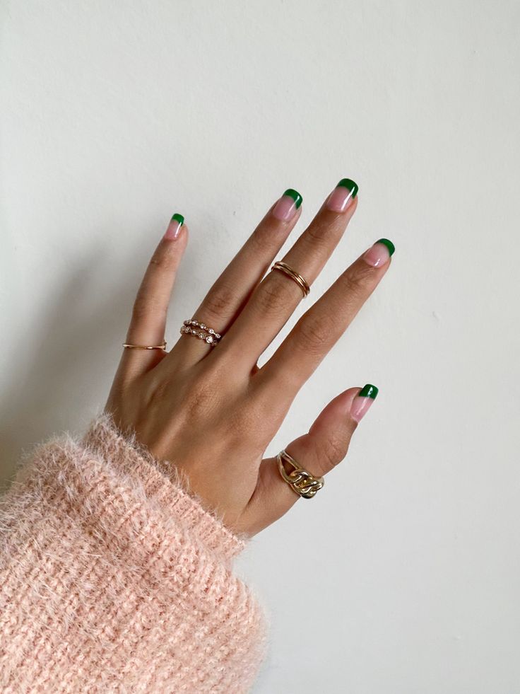 Chic Green-Tipped Manicure with Natural Base and Elegant Accessories.