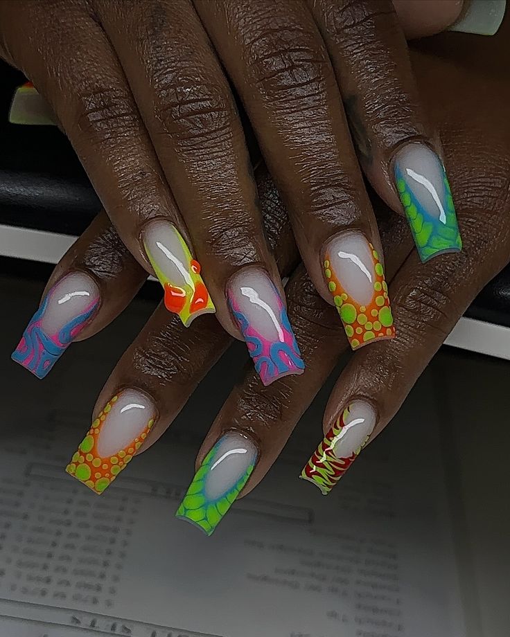 Vibrant and Playful Nail Art Design with Bold Patterns and Gradients