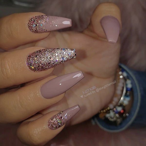 Chic Soft Pink Nail Design with Glitter Accents for Glamorous Occasions.