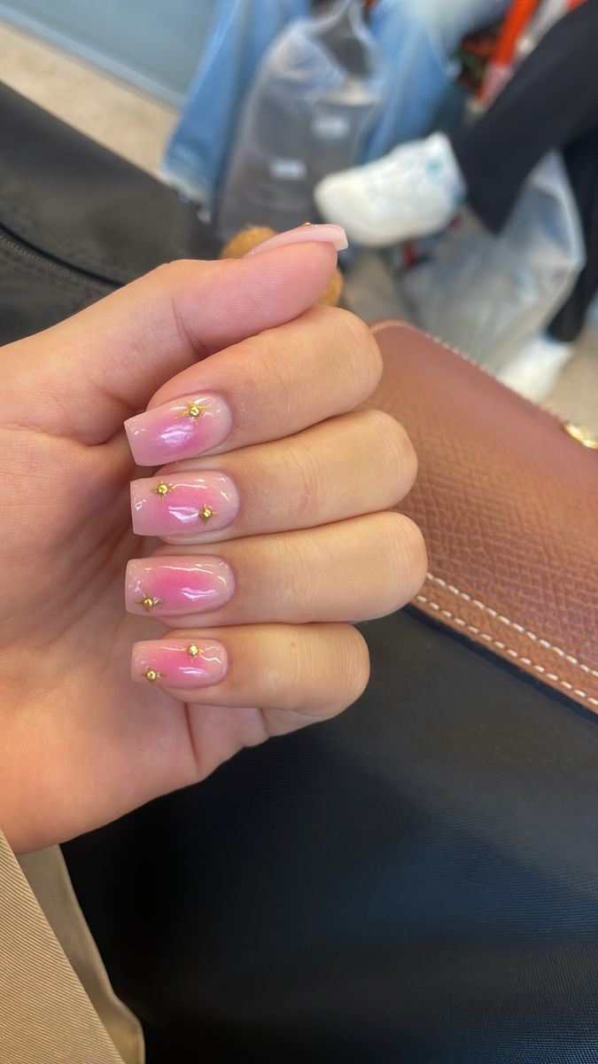 Chic Pink Nails with Gold Accents and Gradient Effect for Effortless Elegance.