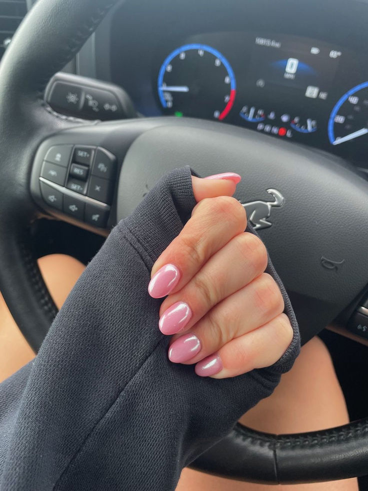 Elegant Pastel Pink Oval Nails: A Glossy Touch for Any Occasion.