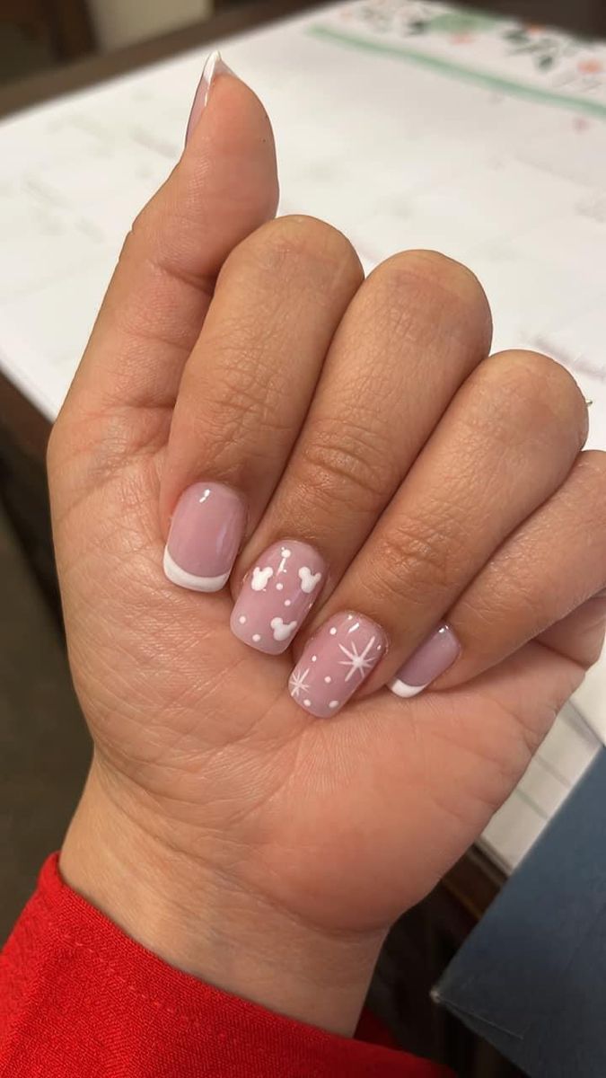 Whimsical Pink Nail Design with White Accents and Elegant French Tips