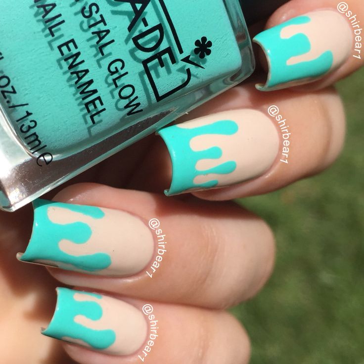 Playful Summer Nail Design: Vibrant Turquoise and Nude with Whimsical Dripping Accents.