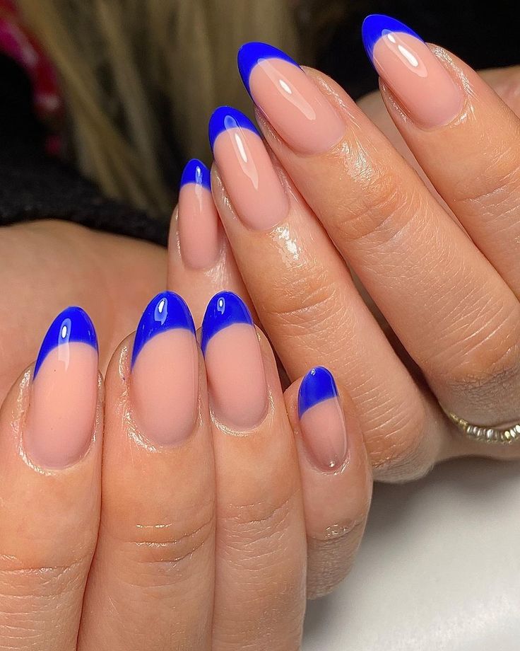 Vibrant Blue-Tipped French Manicure: Playful Elegance with a Modern Twist.