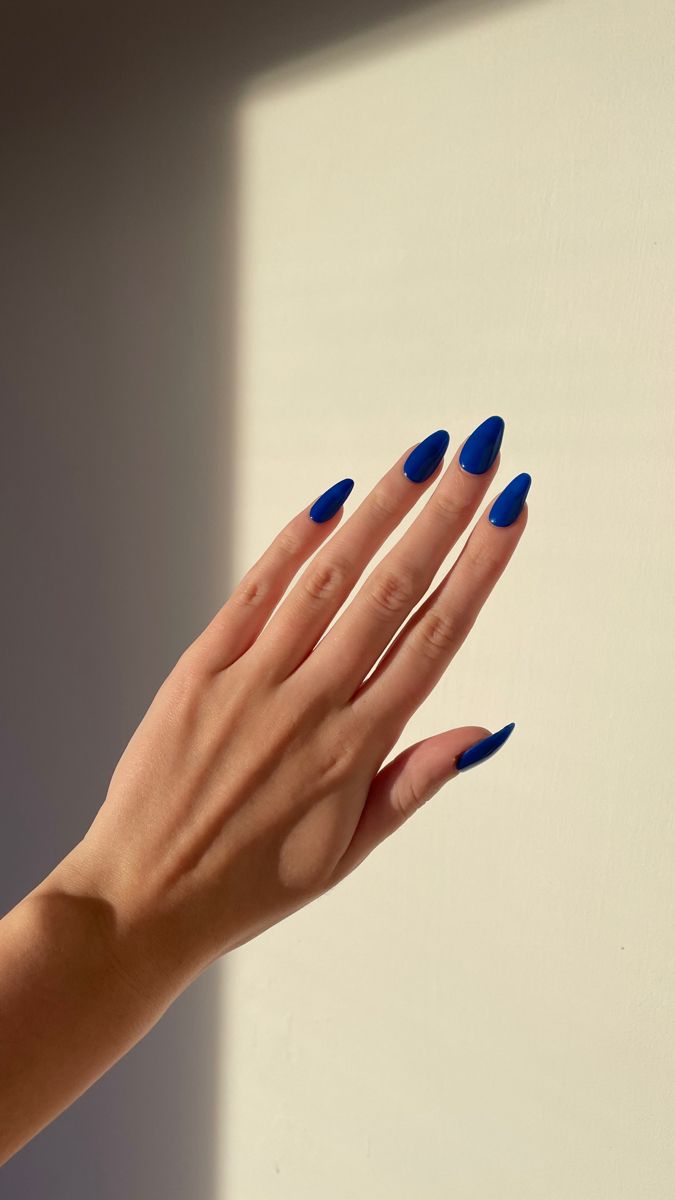 Vibrant Blue Almond-Shaped Nails: A Bold Statement of Elegance and Style.