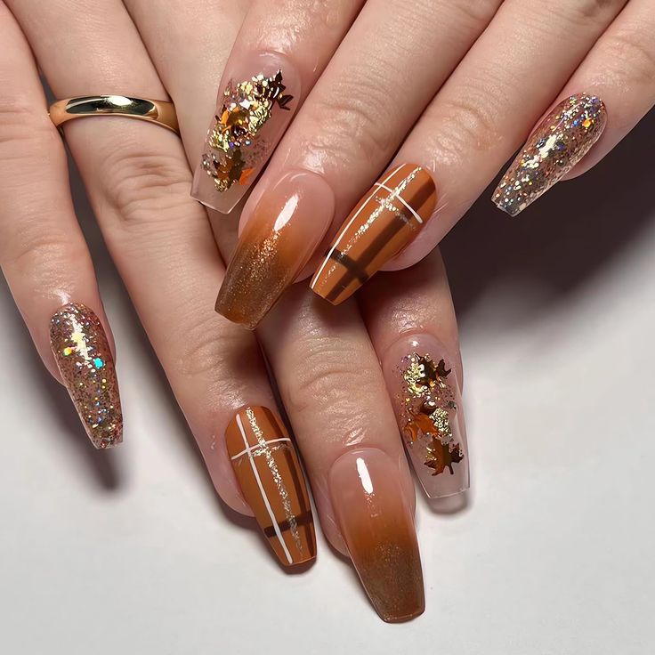 Elegant Autumn Nail Design: Warm Brown and Glittery Gold with Metallic Flakes and Gradient Effects