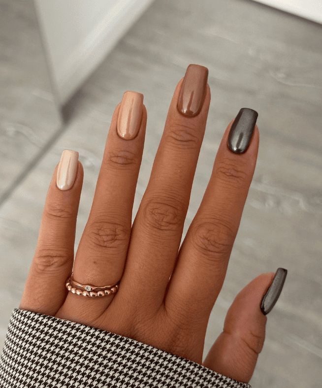 Elegant Gradient Nail Design in Neutral and Dark Shades.