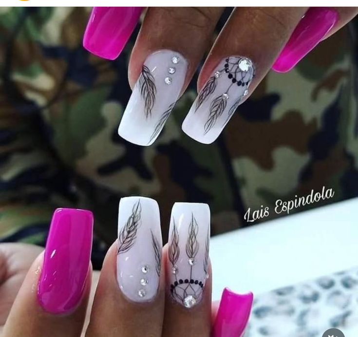 Elegant Nail Design: Vibrant Pink and White with Intricate Hand-Painted Details