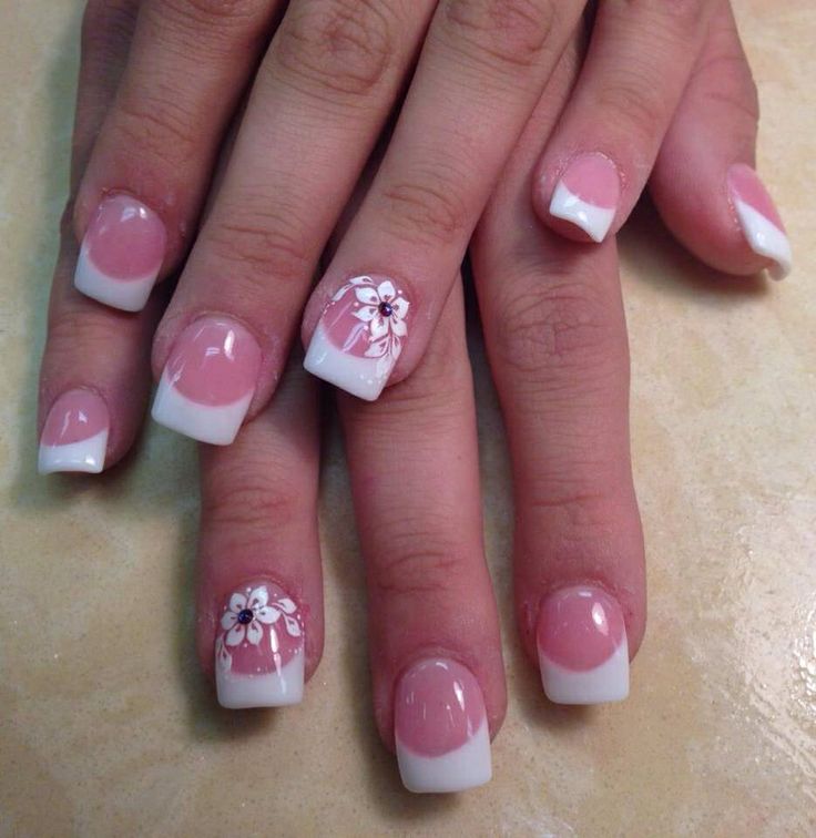 Elegant Floral Nail Design with Soft Pink Base and Striking French Tips.