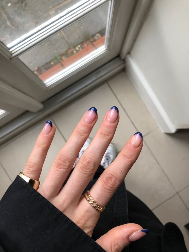 Chic Nail Design: Subtle Nude Base with Bold Blue Tips