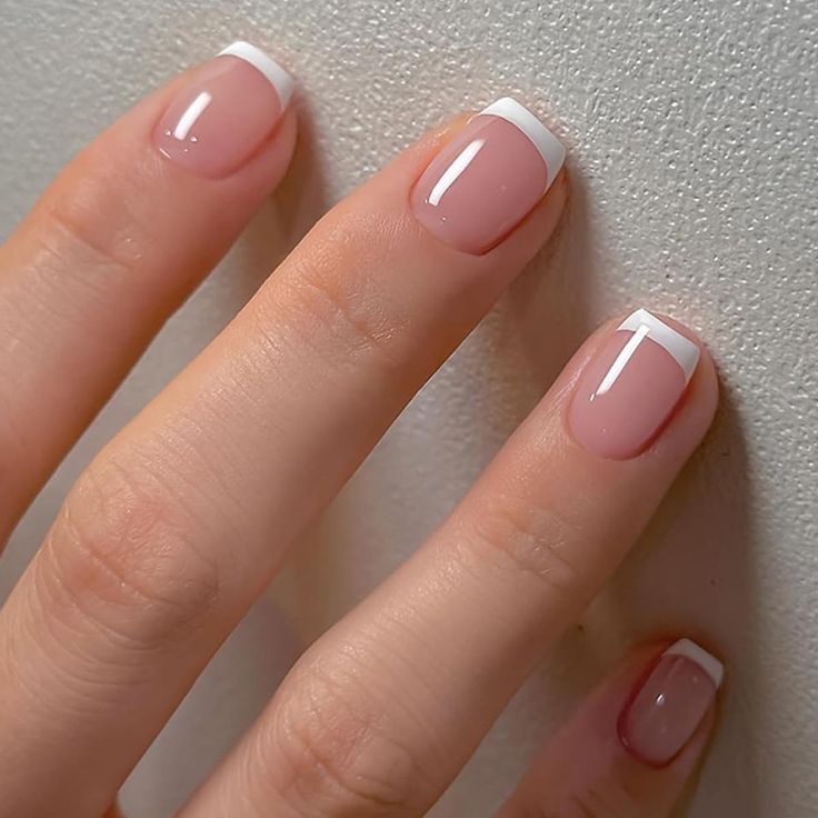 Timeless French Manicure: Elegant Soft Pink Base with Crisp White Tips.