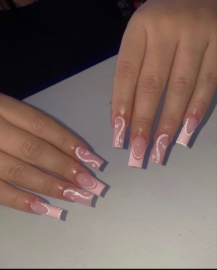 Sophisticated Long Pink Acrylic Nails with Intricate White Swirls and Glossy Finish.