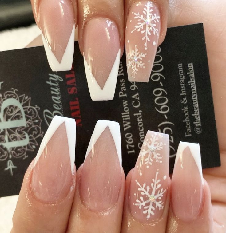 Chic Winter French Tip Nails with Intricate Snowflakes and Soft Pink Base