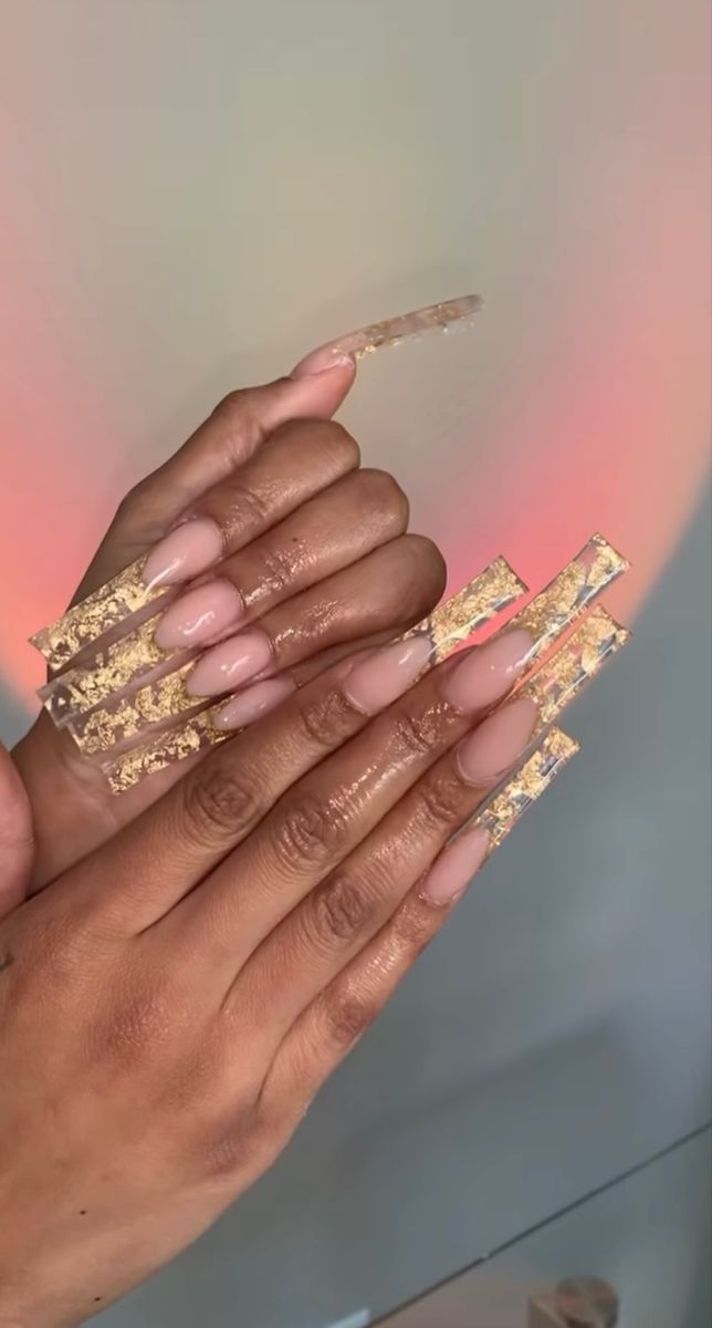 Elegant Long Acrylic Nails with Gold Flakes for a Chic, Modern Look