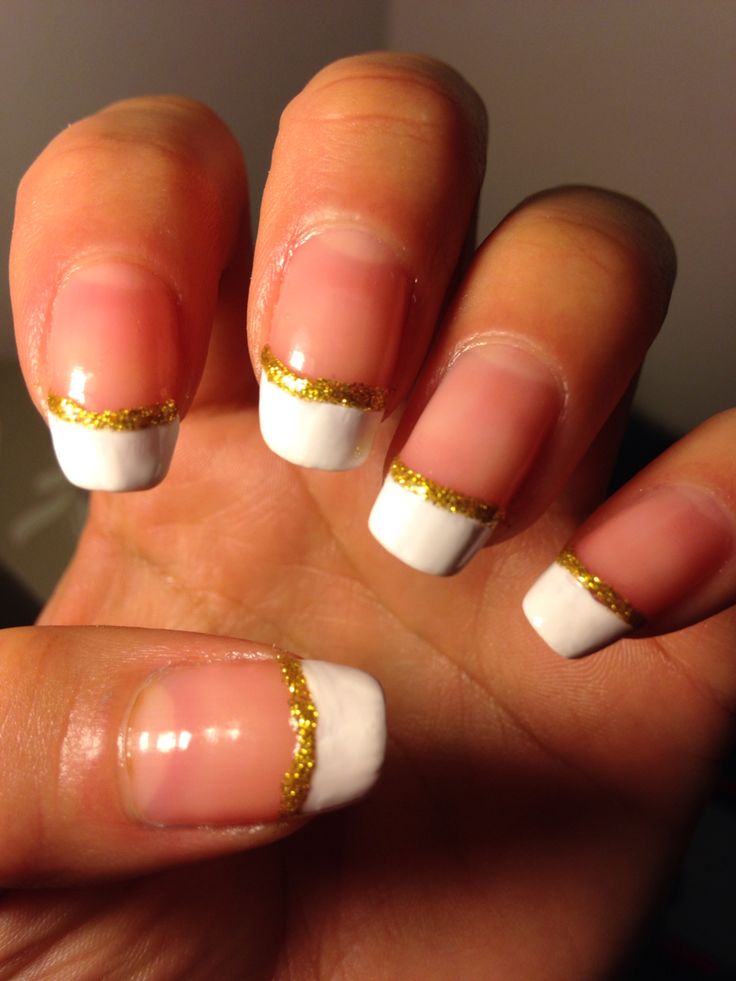 Sophisticated Glossy French Tip Nails with Gold Glitter Accents