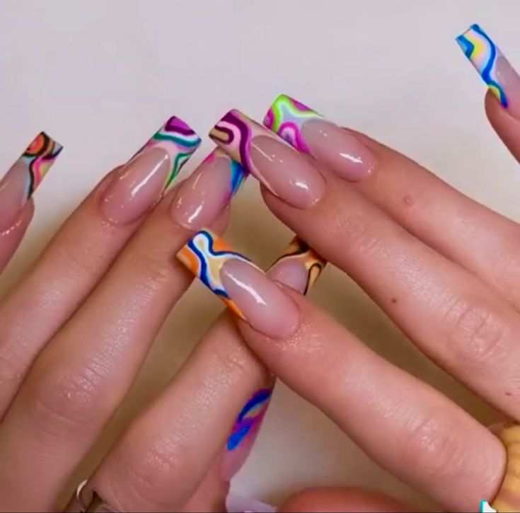 Vibrant Swirl Nail Design with Clear Base: A Playful Statement of Elegance and Artistry.