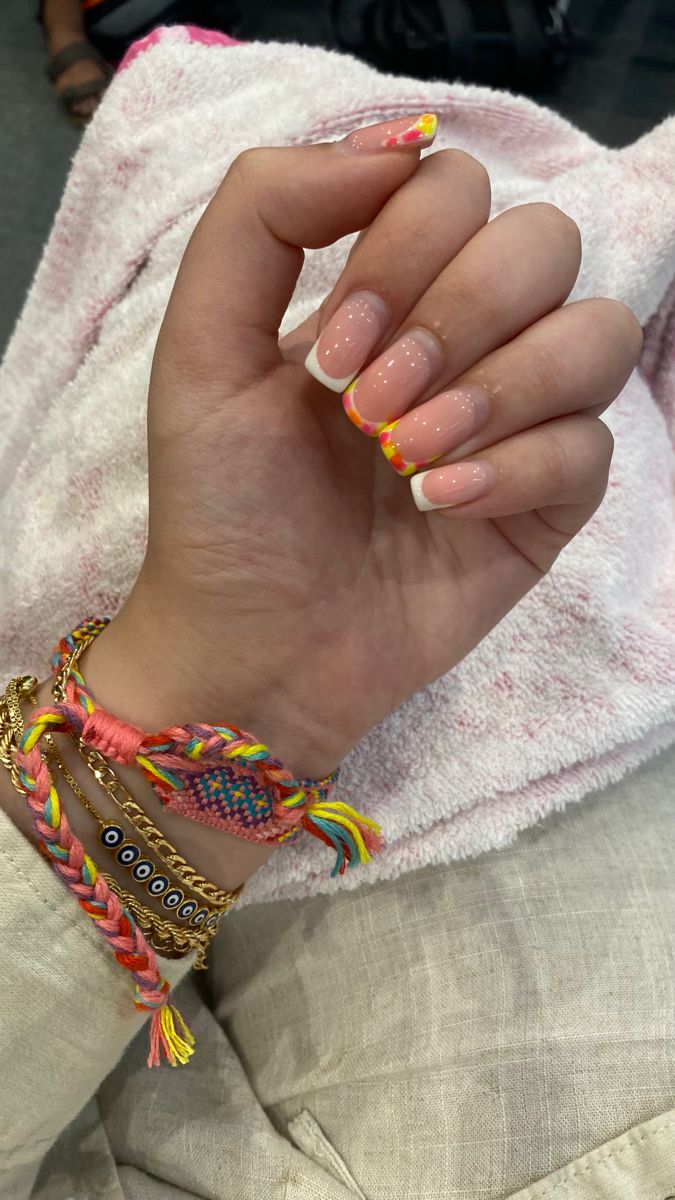 Cheerful Peach Nail Design with Vibrant Yellow and Pink Tips for a Fun Summer Look