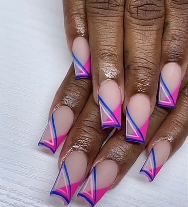 Chic Vibrant Geometric Nail Art with Bold Pink and Blue Accents on a Nude Base.