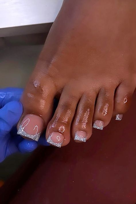 Sophisticated Nude Pedicure with Glamorous Silver Glitter Tips