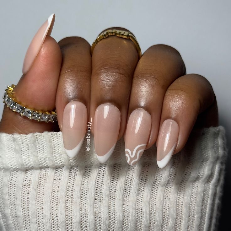 Chic Nude Nail Design with Classic White Tips and Abstract Patterns