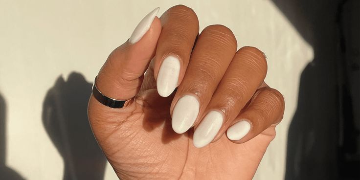 Elegant Almond-Shaped White Nails for a Clean, Minimalist Aesthetic.