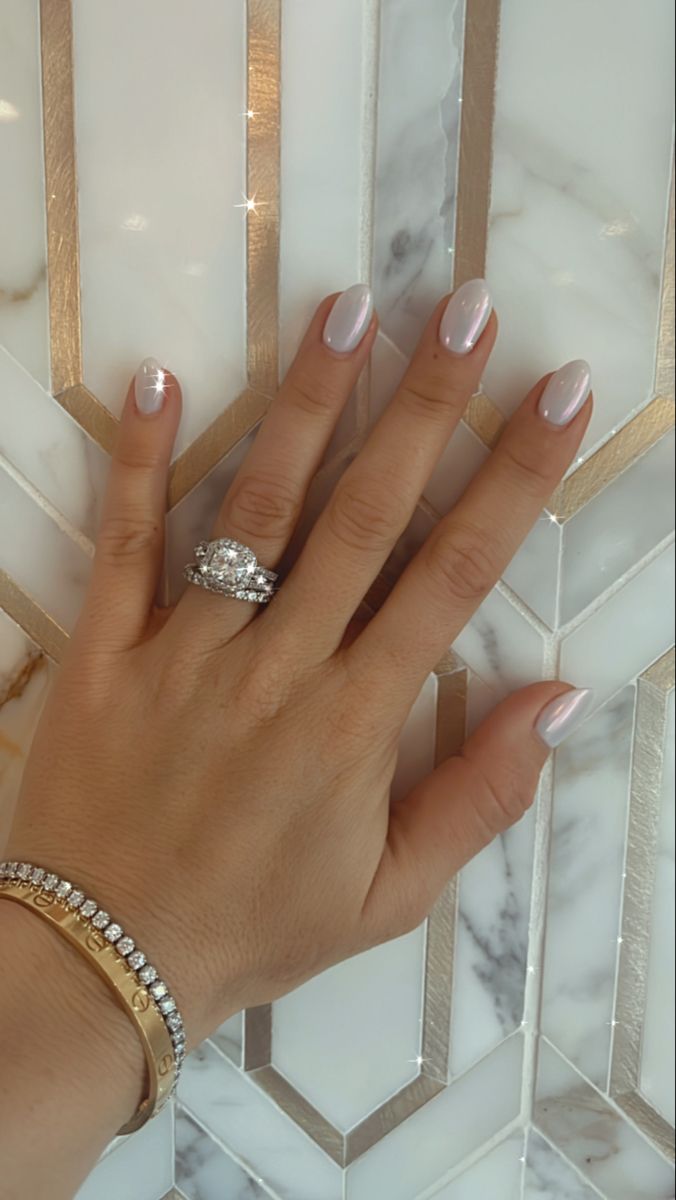 Chic Nude Nail Design with Subtle Sparkling Accent for Modern Sophistication.