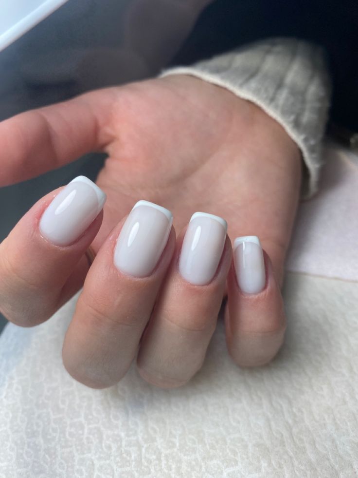 Chic Modern Twist on Classic French Manicure for Sophisticated Elegance.